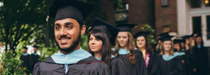 Graduating students in cap and gown